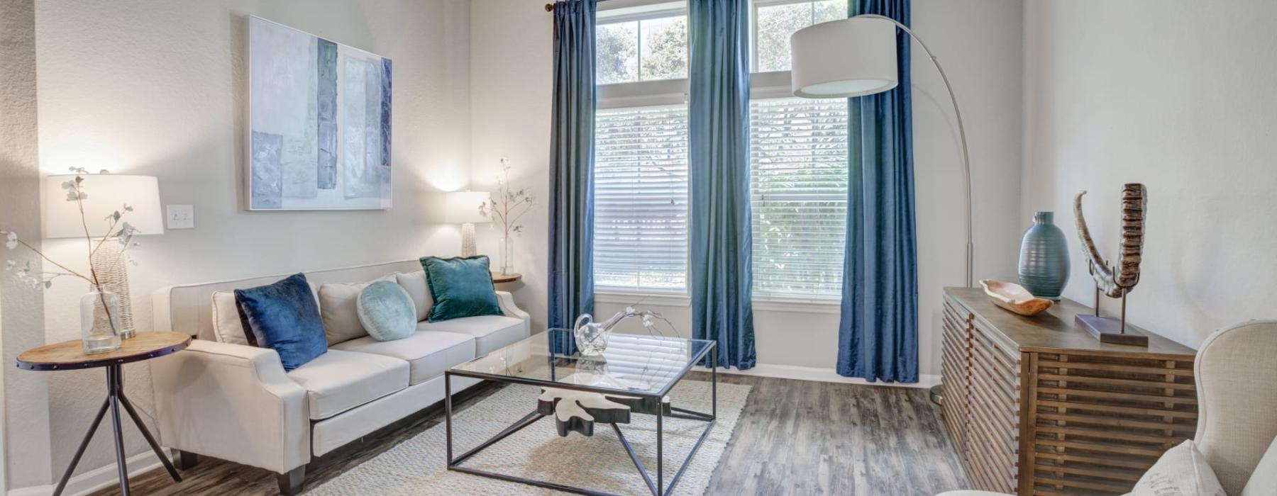 a living room with a white couch and a table