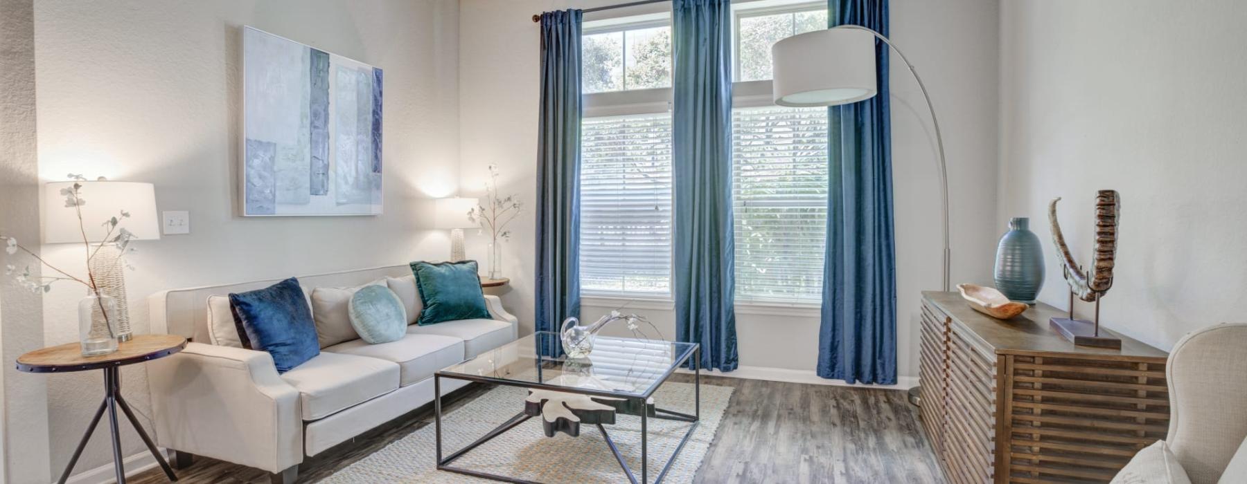 a living room with a white couch and a table