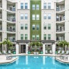 Resort-style swimming pool with lounge seating