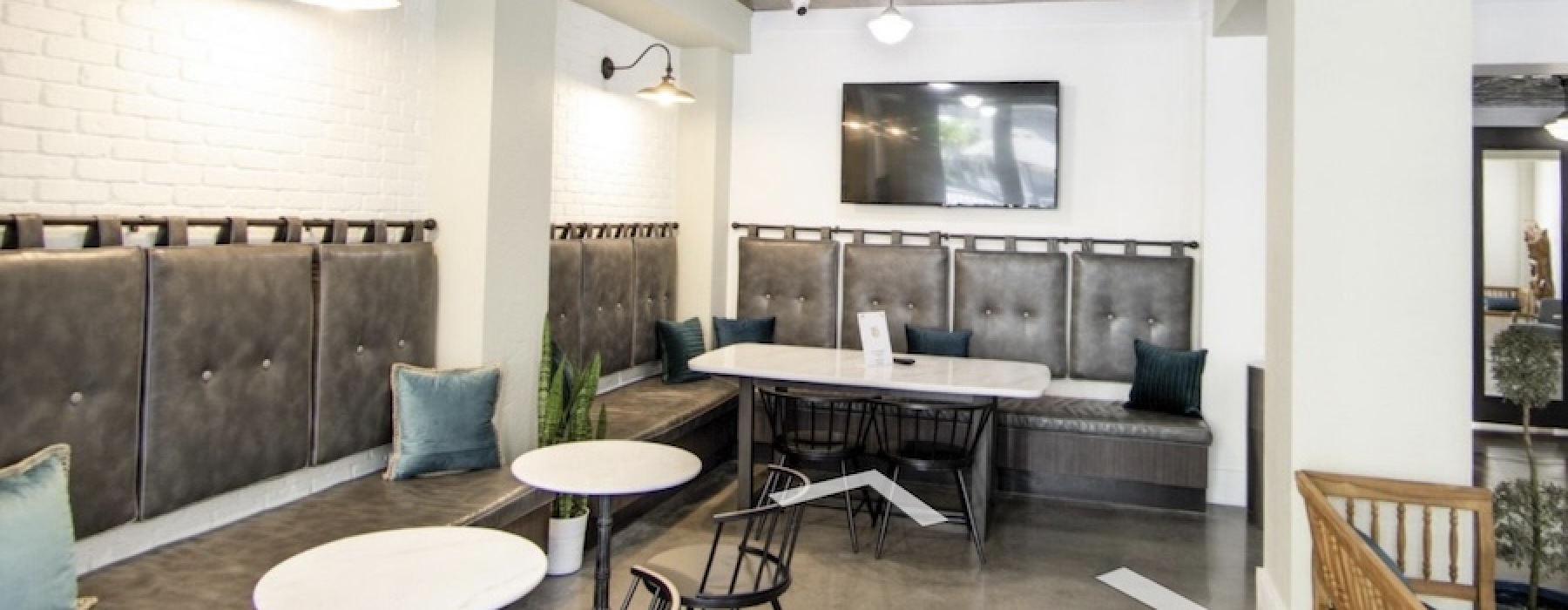a work lounge with tables and chairs