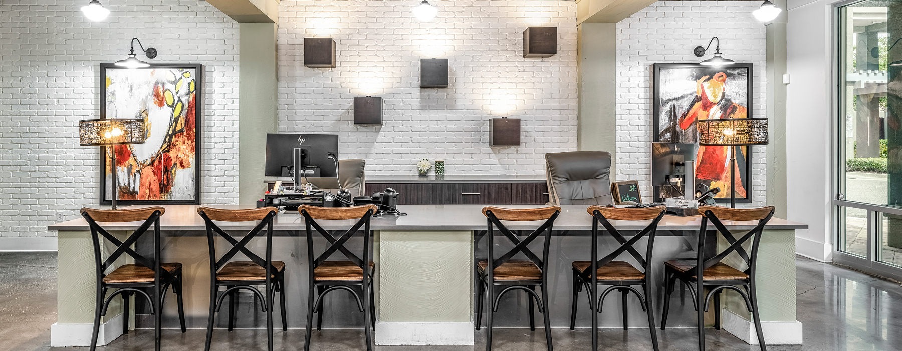 a lounge room and a kitchen with barstools