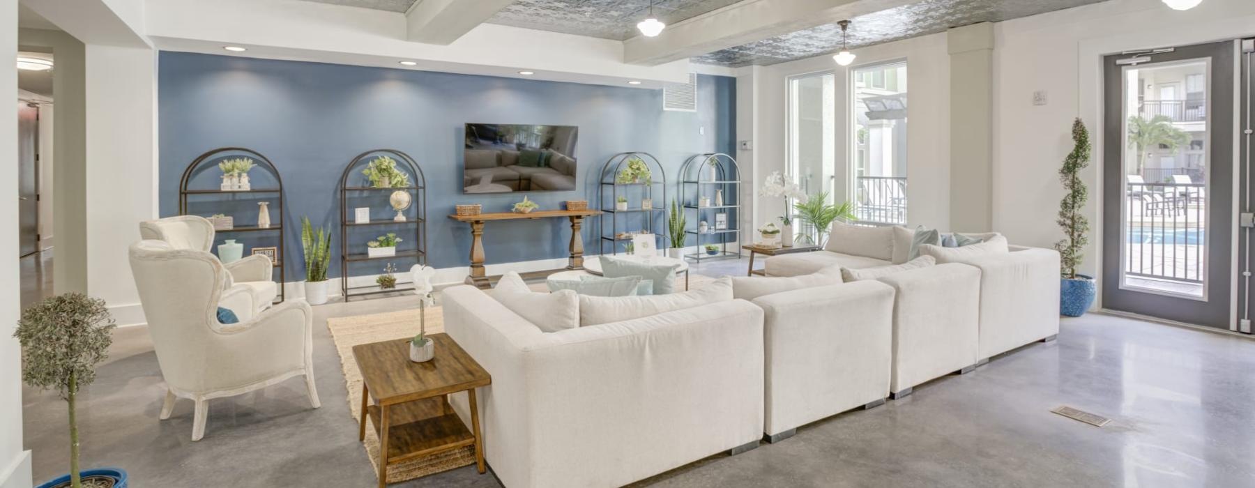 a large room with a large white couch and a table